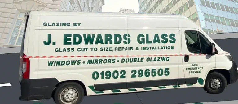 A white J. Edwards Glass van with green sign-writing: glass cut to size, repair and installation, windows, mirrors, double glazing, 24-hour emergency service and the telephone number